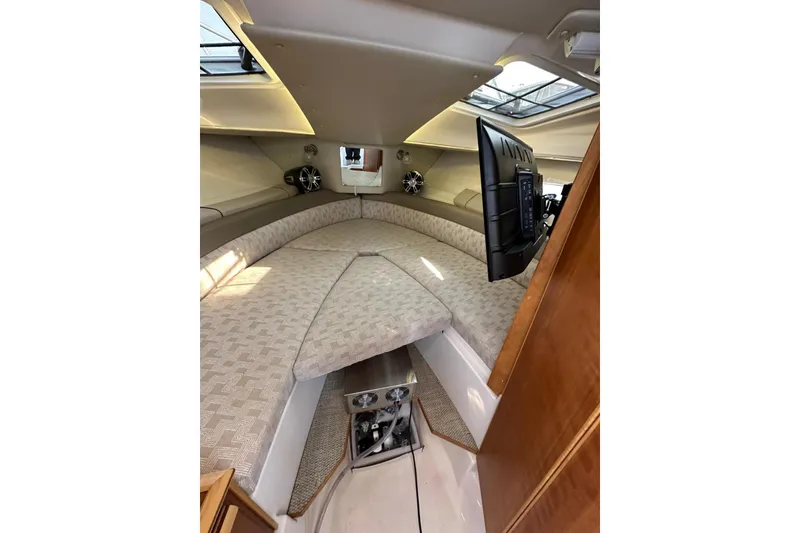 Slide: The Image of Interior of 2022 Cutwater C-24 Coupe boat with cozy seating and modern amenities. - 28