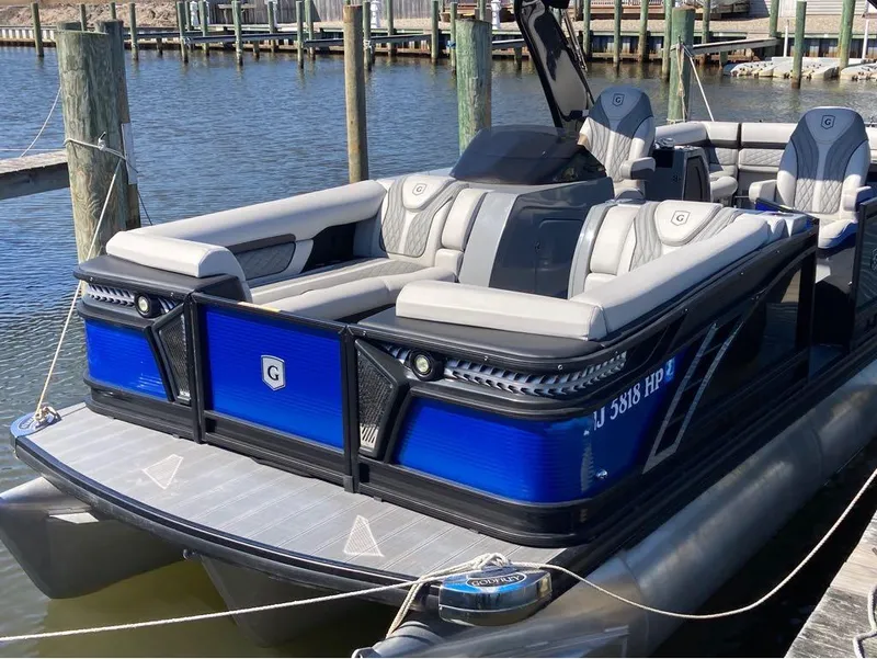 The Image of 2020 Godfrey San Pan 26 pontoon boat docked at a marina. - 1
