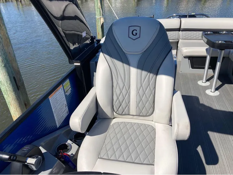 Slide: The Image of Captain's chair on a 2020 Godfrey San Pan 26 pontoon boat. - 22