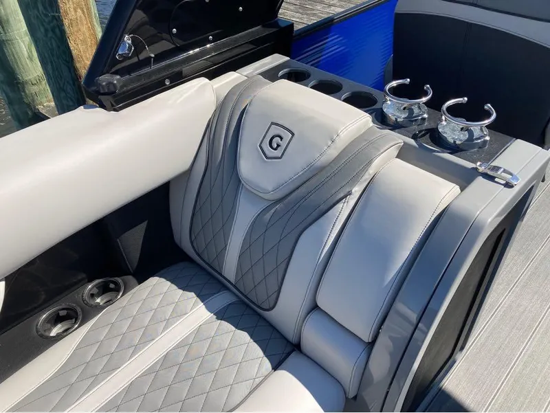 Slide: The Image of Luxurious seating on a 2020 Godfrey San Pan 26 pontoon boat with cup holders. - 5