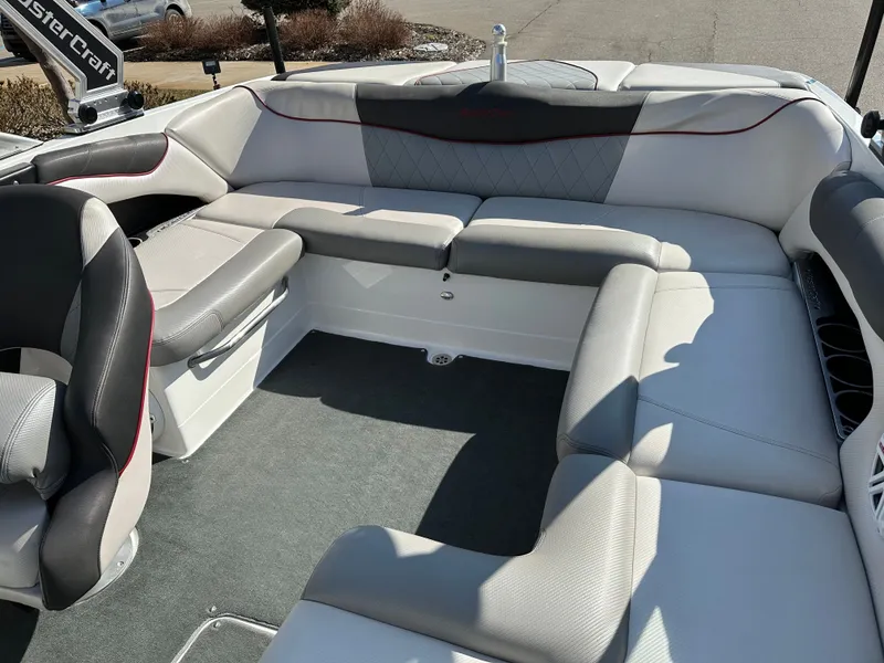 Slide: The Image of Interior of a 2011 MasterCraft X2 boat with gray and white seating. - 12