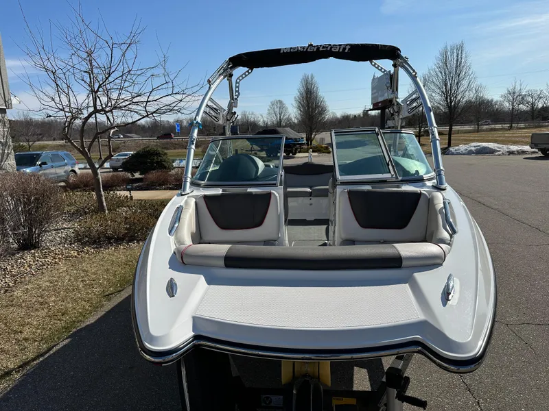 Slide: The Image of 2011 MasterCraft X2 boat parked outdoors on a sunny day. - 4