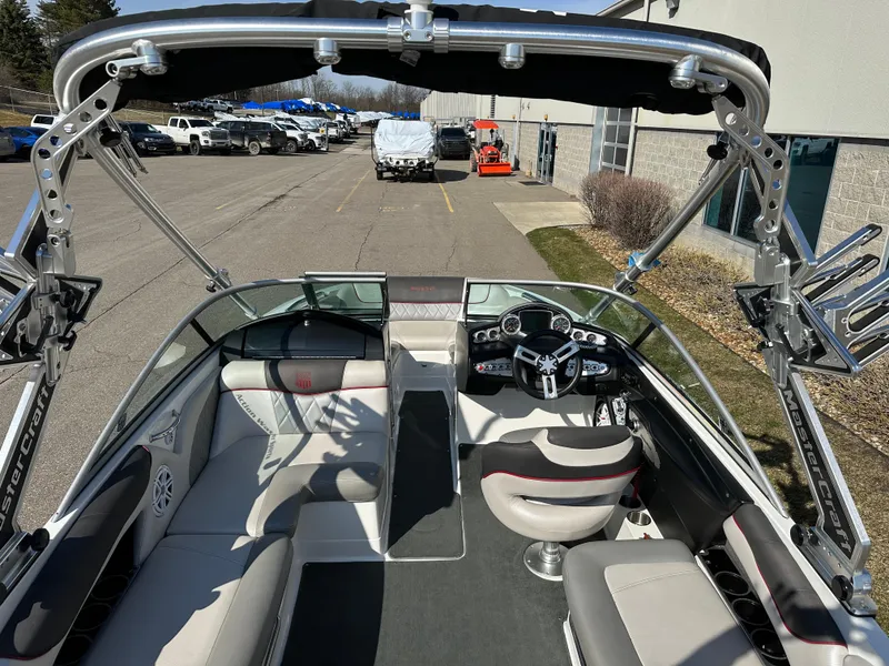 Slide: The Image of Interior view of a 2011 MasterCraft X2 boat in a parking lot. - 7