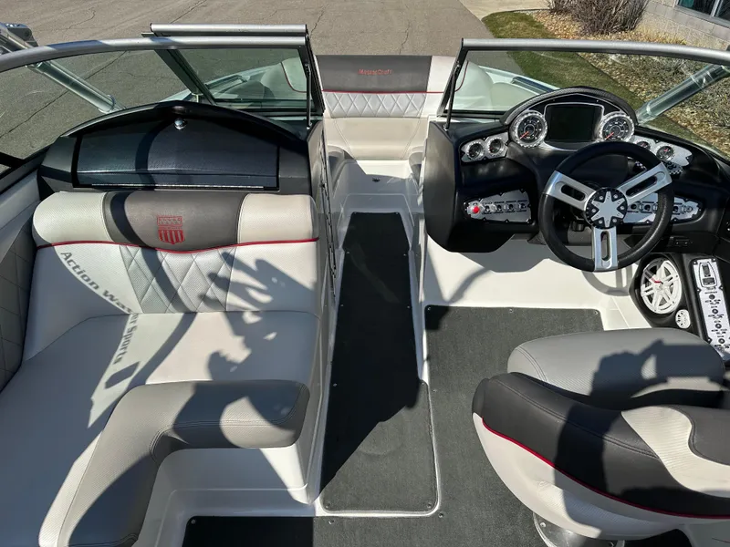 Slide: The Image of Interior of a 2011 MasterCraft X2 boat with modern dashboard. - 8