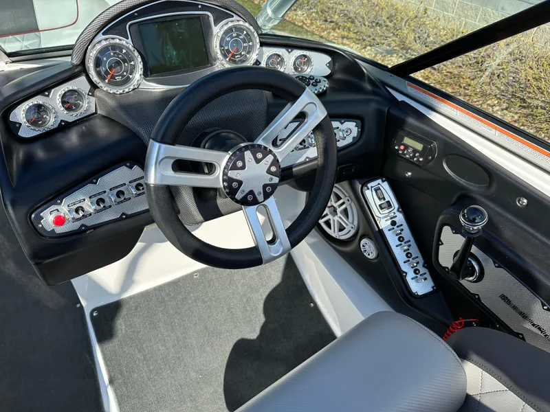 Slide: The Image of Interior view of 2011 MasterCraft X2 boat cockpit with controls. - 9