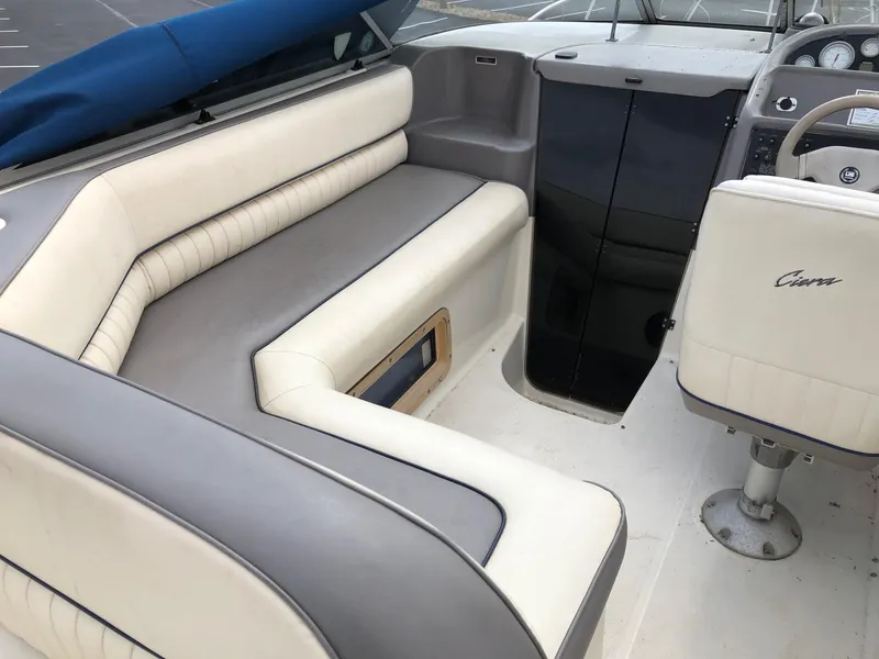Slide: The Image of 1994 Bayliner 2655 Cierra boat interior with white and gray seating. - 14