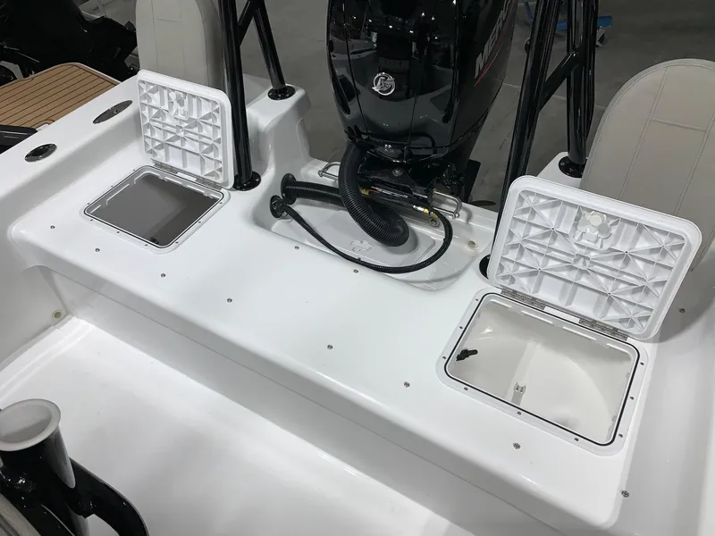 Slide: The Image of 2024 Savannah SS21 boat with open storage compartments and motor. - 5