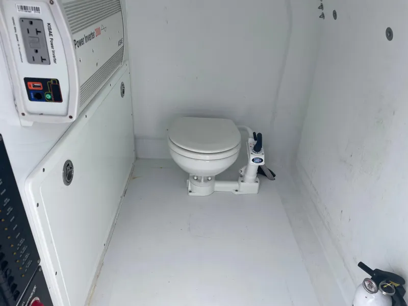 Slide: The Image of Compact marine toilet in Freeman 37 boat, 2019 model, with power panel and fire extinguisher. - 29