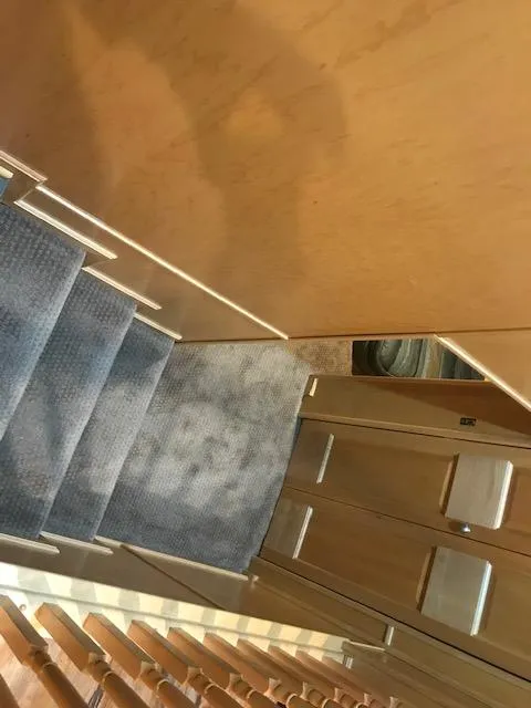 Slide: The Image of Interior stairs of a 2002 Sumerset Houseboat with carpeted steps. - 24