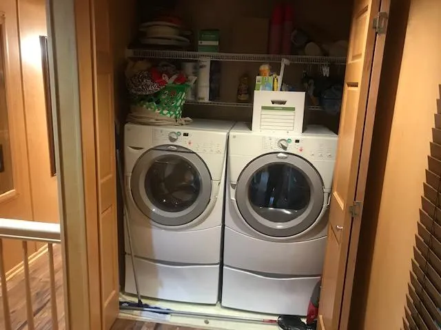 Slide: The Image of Laundry area with washer and dryer on a 2002 Sumerset Houseboat. - 28