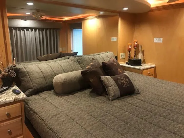 Slide: The Image of Luxurious bedroom interior of a 2002 Sumerset Houseboat with cozy bedding and modern decor. - 31