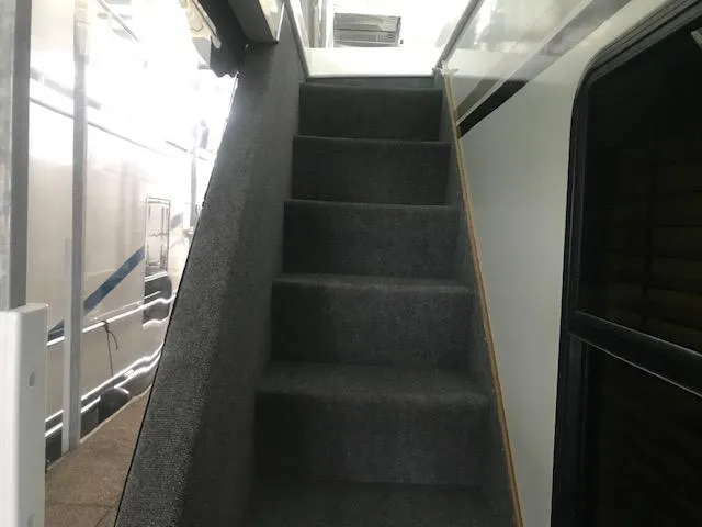 Slide: The Image of Staircase inside 2002 Sumerset Houseboat with carpeted steps. - 36