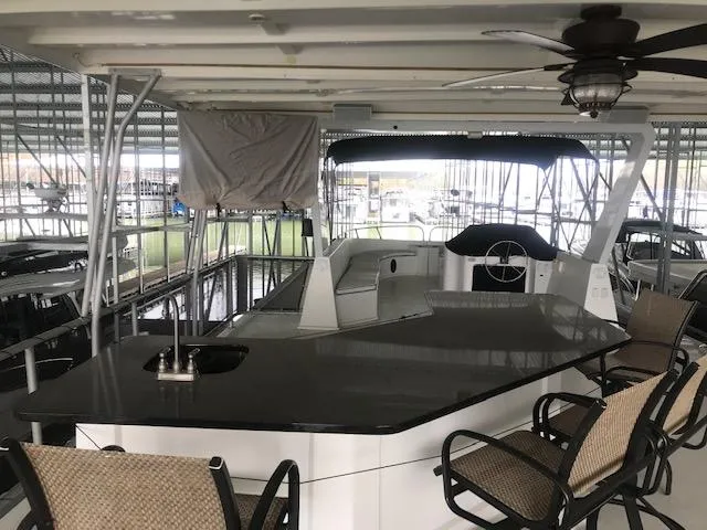 Slide: The Image of 2002 Sumerset Houseboat interior with bar and seating area. - 39