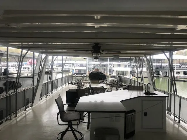 Slide: The Image of 2002 Sumerset Houseboat with spacious deck and seating area. - 44