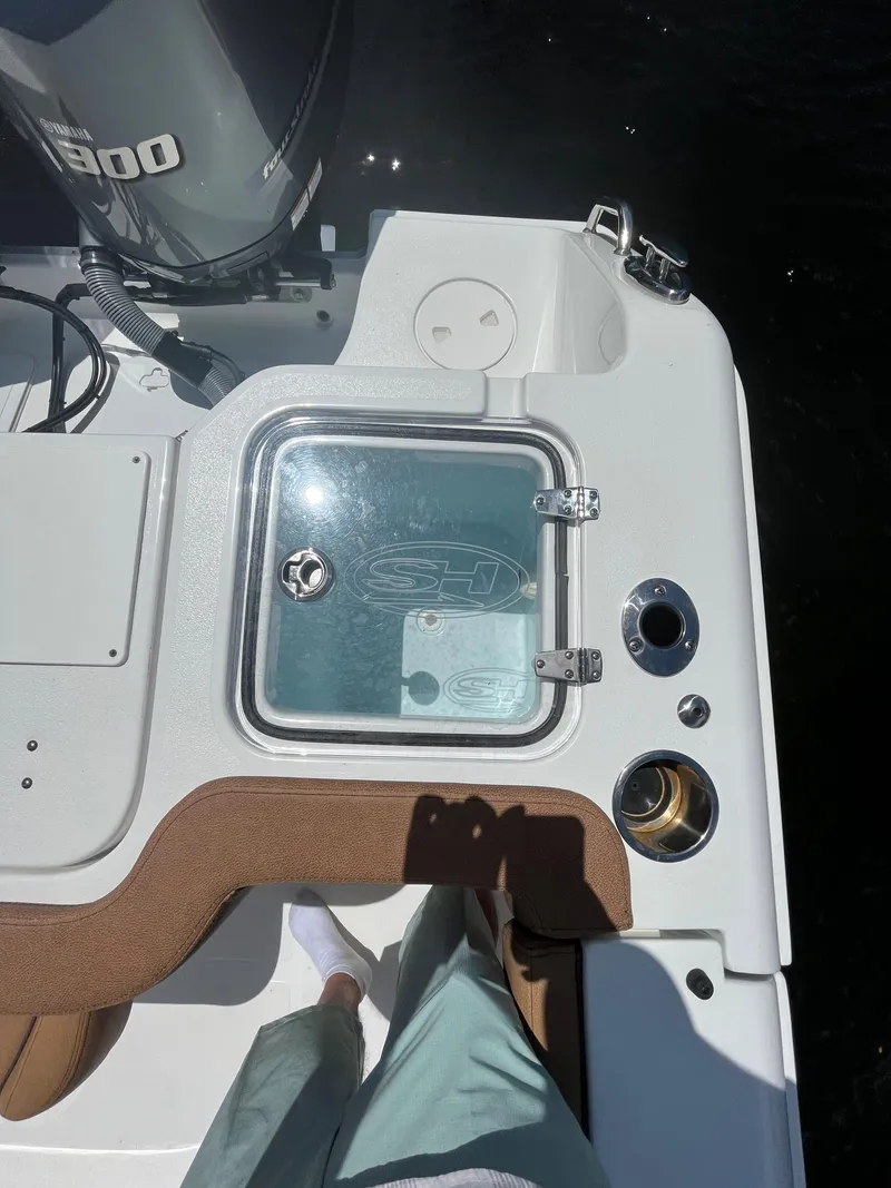 Slide: The Image of 2020 Sea Hunt 30 Gamefish boat deck with livewell and engine. - 10