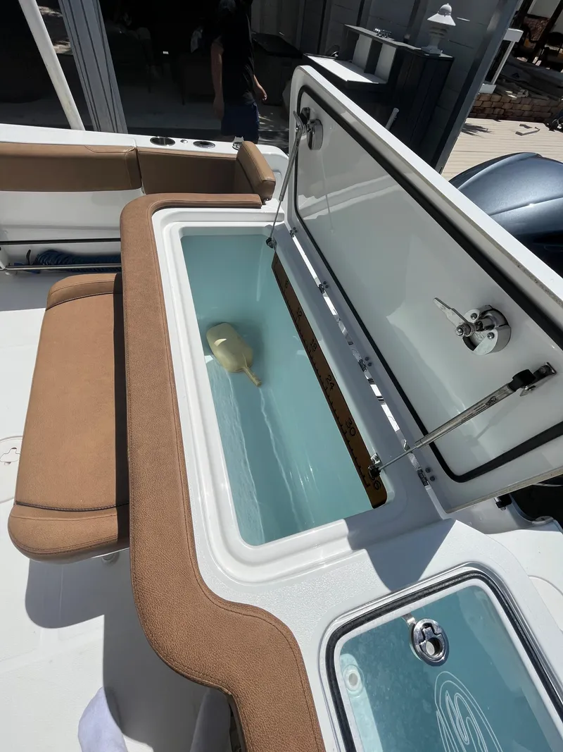 Slide: The Image of 2020 Sea Hunt 30 Gamefish boat with open livewell and seating area. - 11