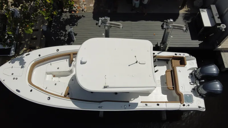 Slide: The Image of 2020 Sea Hunt 30 Gamefish boat docked, aerial view showing dual engines and spacious deck. - 3