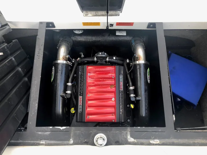 Slide: The Image of 2013 Malibu Wakesetter VLX engine compartment with red and black components. - 4