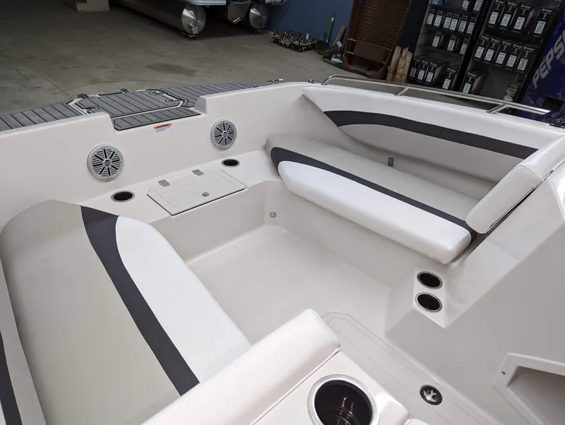 Slide: The Image of 2023 Starcraft SVX 171 OB boat interior with white and gray seating. - 3