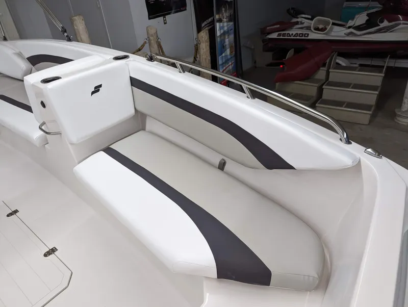Slide: The Image of 2023 Starcraft SVX 171 OB boat interior with white and gray seating. - 6