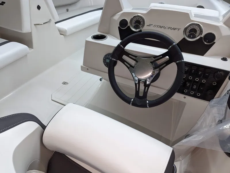 Slide: The Image of 2023 Starcraft SVX 171 OB boat interior with steering wheel and control panel. - 8