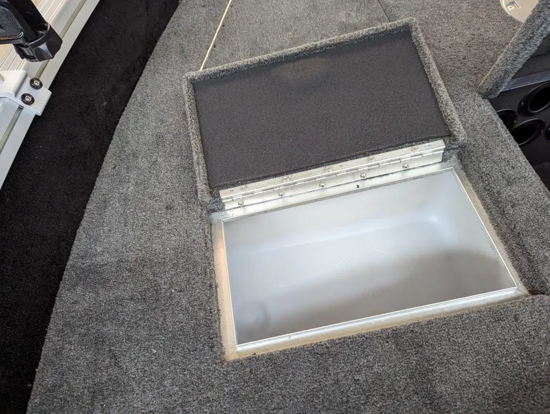 Slide: The Image of 2023 Smoker Craft Adventurer 188 T storage compartment with open lid. - 10