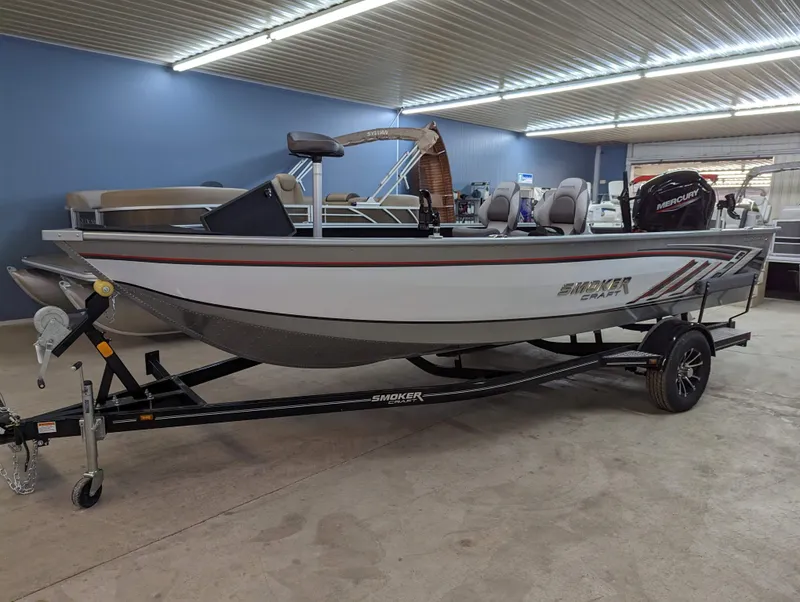 Slide: The Image of 2023 Smoker Craft Adventurer 188 T fishing boat in showroom. - 2