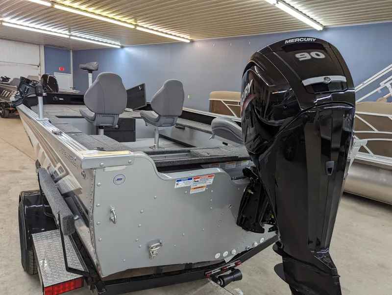 Slide: The Image of 2023 Smoker Craft Adventurer 188 T boat with Mercury 90 outboard motor in showroom. - 3