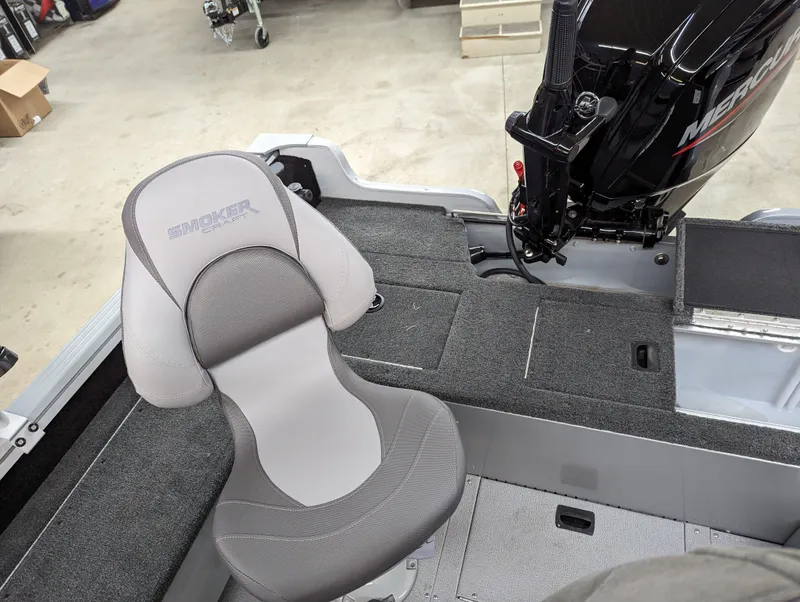 Slide: The Image of 2023 Smoker Craft Adventurer 188 T boat interior with seating and Mercury engine. - 4