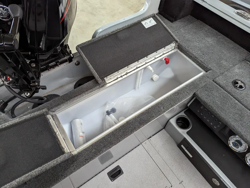 Slide: The Image of 2023 Smoker Craft Adventurer 188 T boat interior storage compartment with open lid. - 5