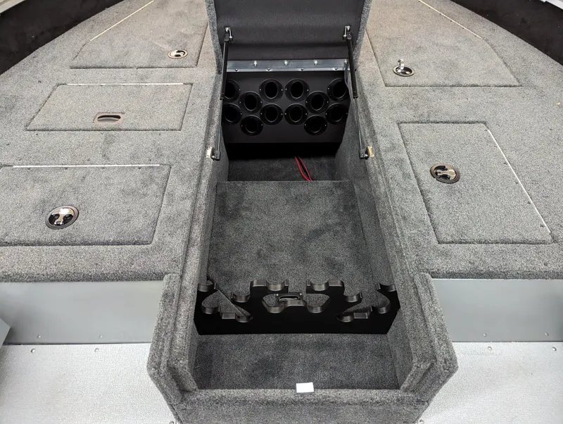 Slide: The Image of 2023 Smoker Craft Adventurer 188 T boat interior with storage compartments. - 9