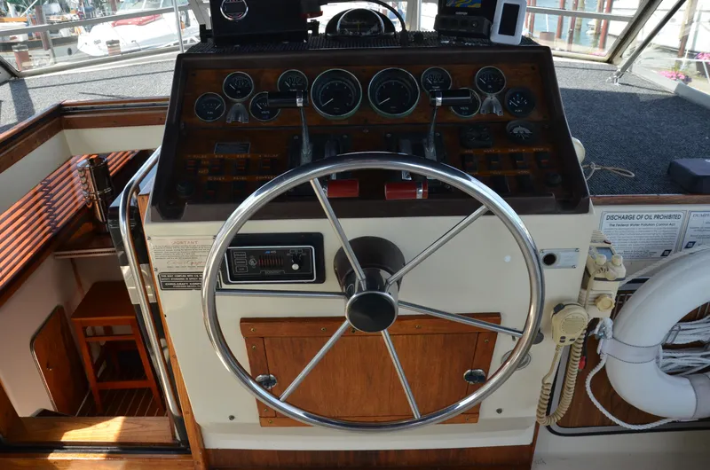 Slide: The Image of 1984 Chris-Craft 381 Catalina helm with classic wooden dashboard and steering wheel. - 13