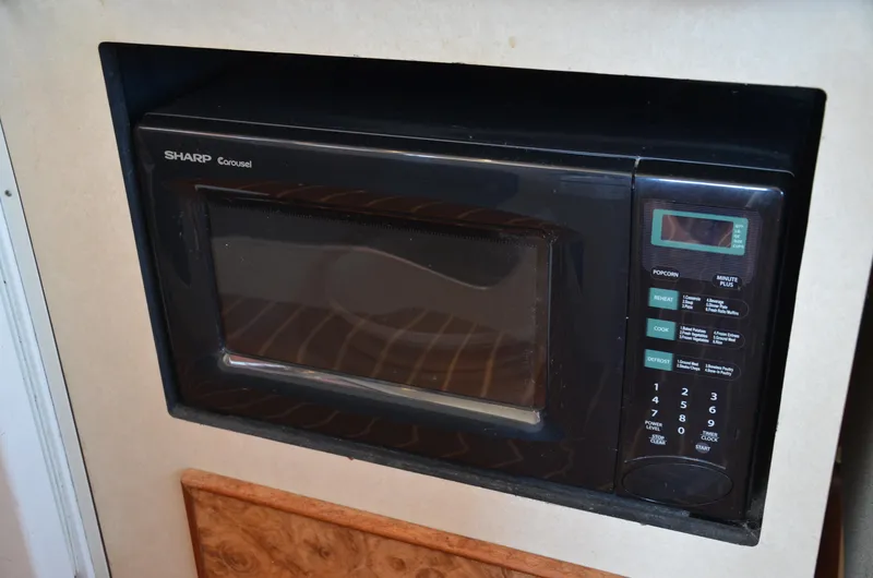 Slide: The Image of Built-in Sharp Carousel microwave in 1984 Chris-Craft 381 Catalina boat kitchen. - 28