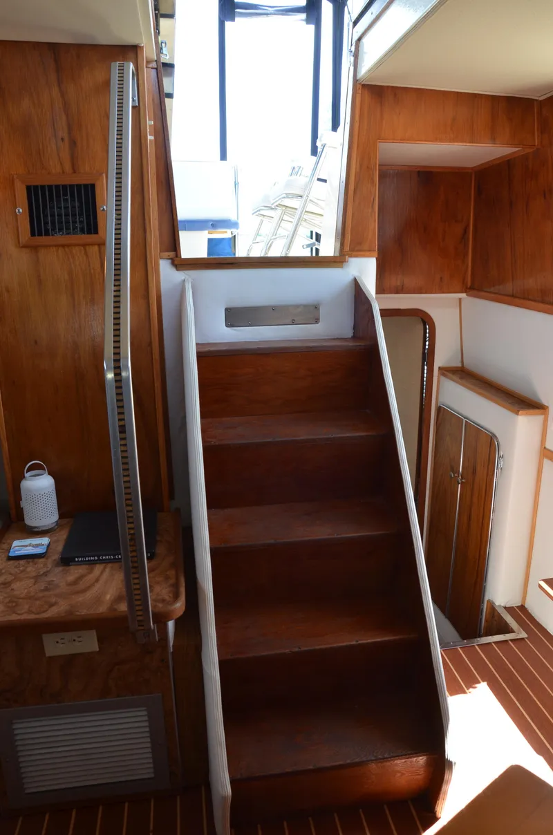 Slide: The Image of 1984 Chris-Craft 381 Catalina interior with wooden stairs and cabinetry. - 36
