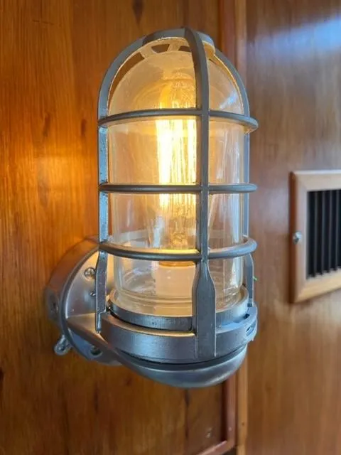 Slide: The Image of Nautical-style wall light on 1984 Chris-Craft 381 Catalina boat interior. - 43