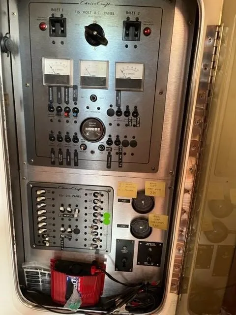 Slide: The Image of Electrical panel of a 1984 Chris-Craft 381 Catalina boat with gauges and switches. - 44