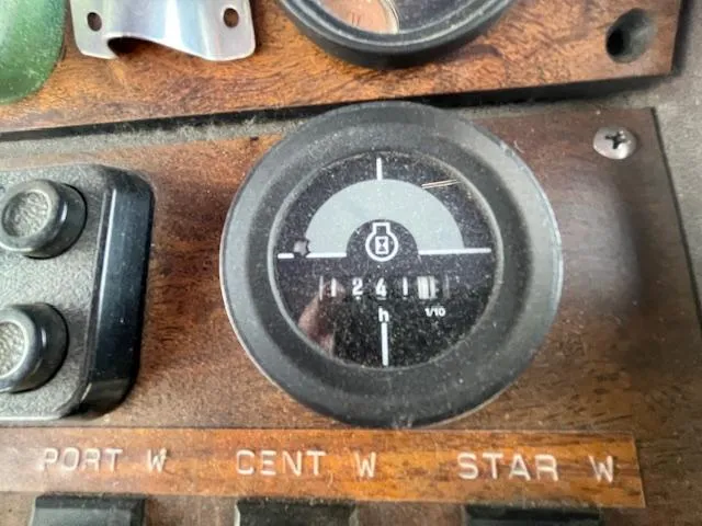 Slide: The Image of 1984 Chris-Craft 381 Catalina dashboard gauge with hour meter and switches. - 45