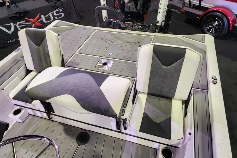 Slide: The Image of 2023 Vexus AVX2180CC boat interior with dual seats and storage compartments. - 10