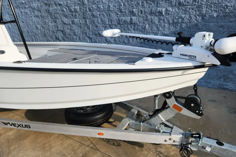 Slide: The Image of 2023 Vexus AVX2180CC boat on trailer with Minn Kota trolling motor. - 2