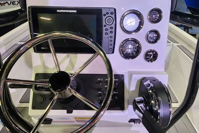 Slide: The Image of 2023 Vexus AVX2180CC boat console with steering wheel, Humminbird display, and gauges. - 4