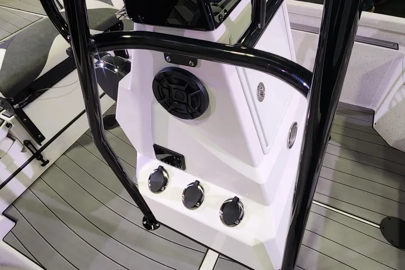 Slide: The Image of 2023 Vexus AVX2180CC boat console with black railings and control panel. - 6