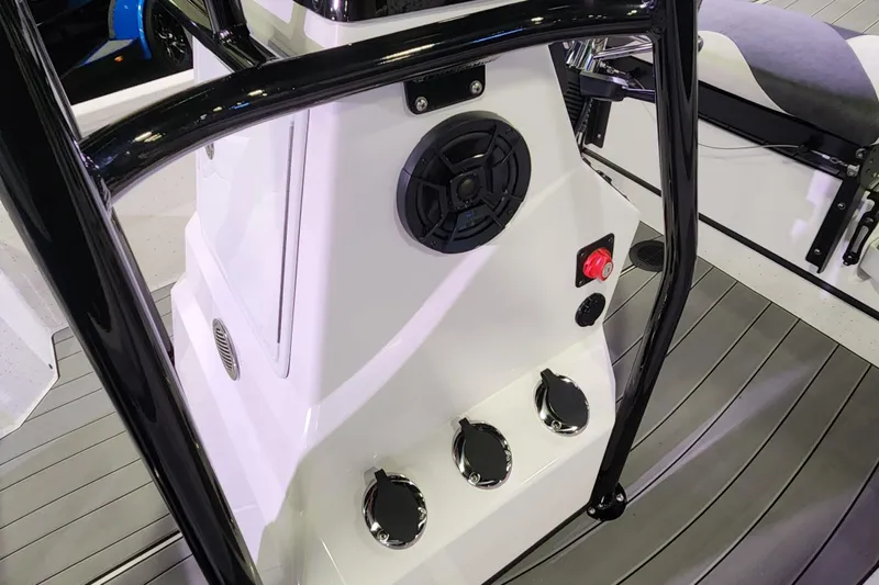 Slide: The Image of 2023 Vexus AVX2180CC boat console with speaker and control panel. - 7