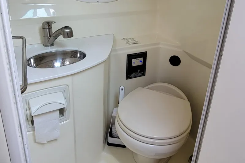 Slide: The Image of 2016 Monterey 275 Sport Yacht bathroom with sink and toilet. - 11