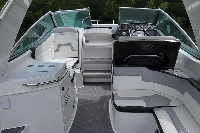 Slide: The Image of 2016 Monterey 275 Sport Yacht interior with seating and helm. - 4