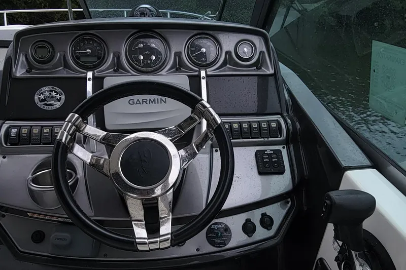 Slide: The Image of 2016 Monterey 275 Sport Yacht dashboard with Garmin navigation system. - 5