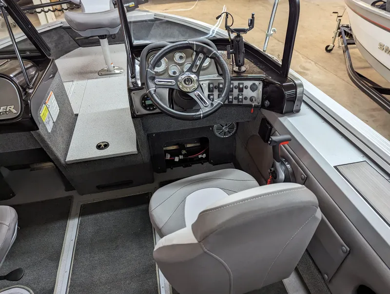 Slide: The Image of 2023 Smoker Craft Pro Angler XL 182 boat interior with steering console and seating. - 4