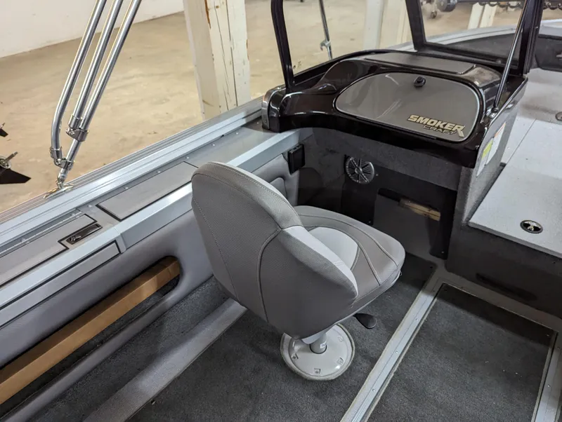 Slide: The Image of 2023 Smoker Craft Pro Angler XL 182 boat interior with captain's chair and dashboard. - 5