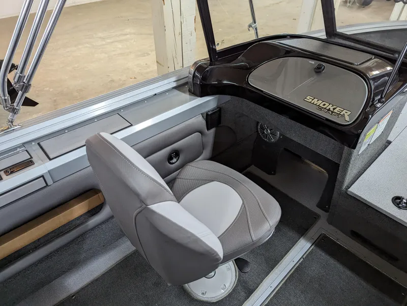 Slide: The Image of 2023 Smoker Craft Pro Angler XL 182 boat interior with captain's chair and dashboard. - 8