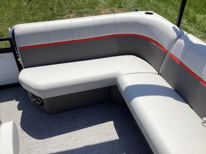 Slide: The Image of Qwest 820 Lanai L 2023 boat interior with gray and red cushioned seating. - 10