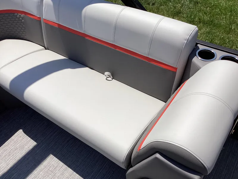 Slide: The Image of 2023 Qwest 820 Lanai L boat interior with gray and red cushioned seating. - 11